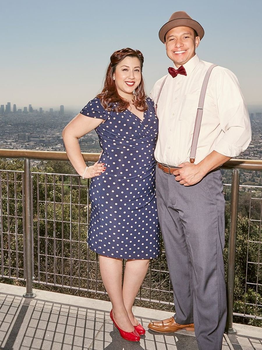 Newlyweds at a Griffith Park overlook with the Los Angeles skyline behind them