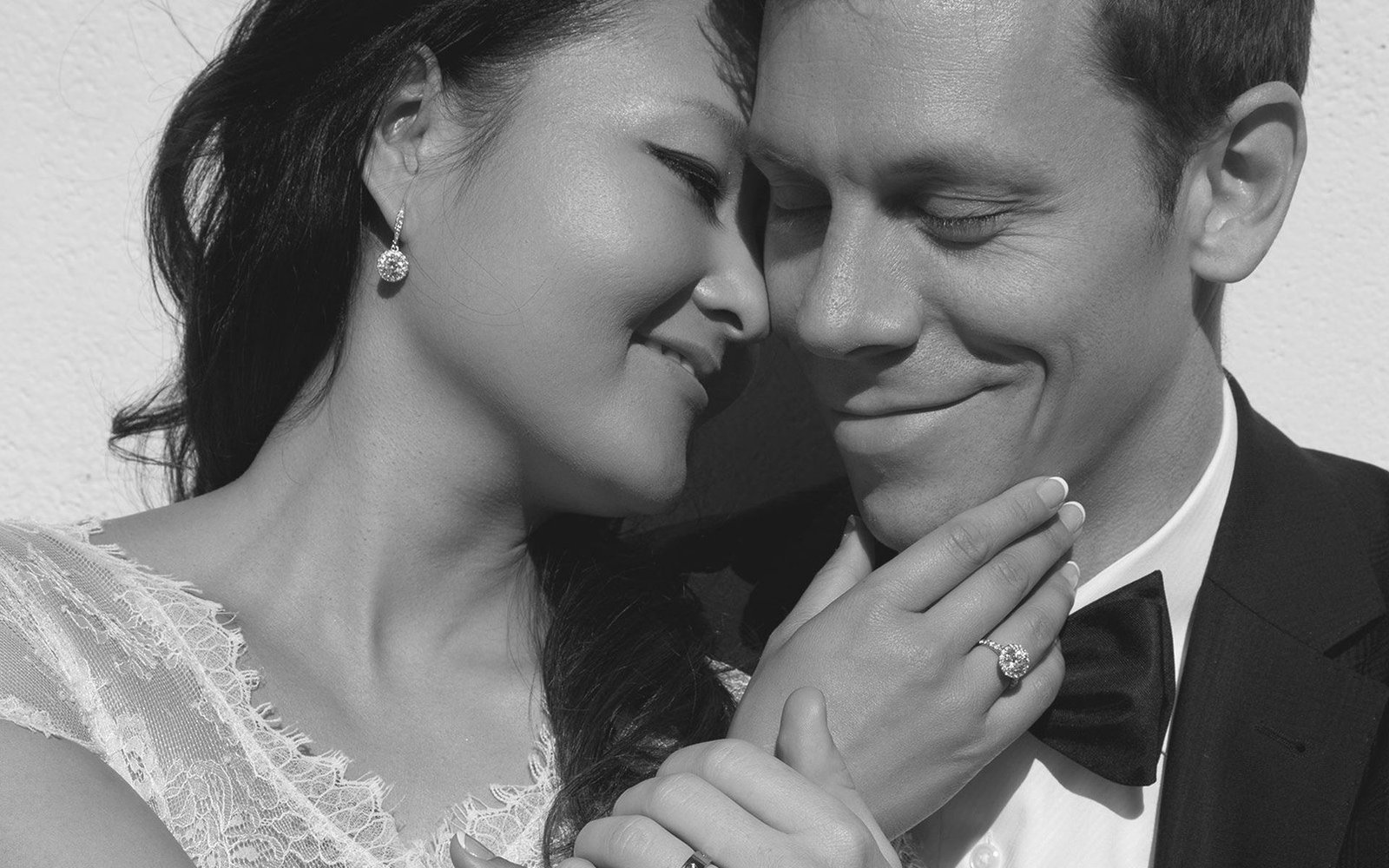 Black-and-white portrait of a bride and groom resting their foreheads together at a Los Angeles wedding